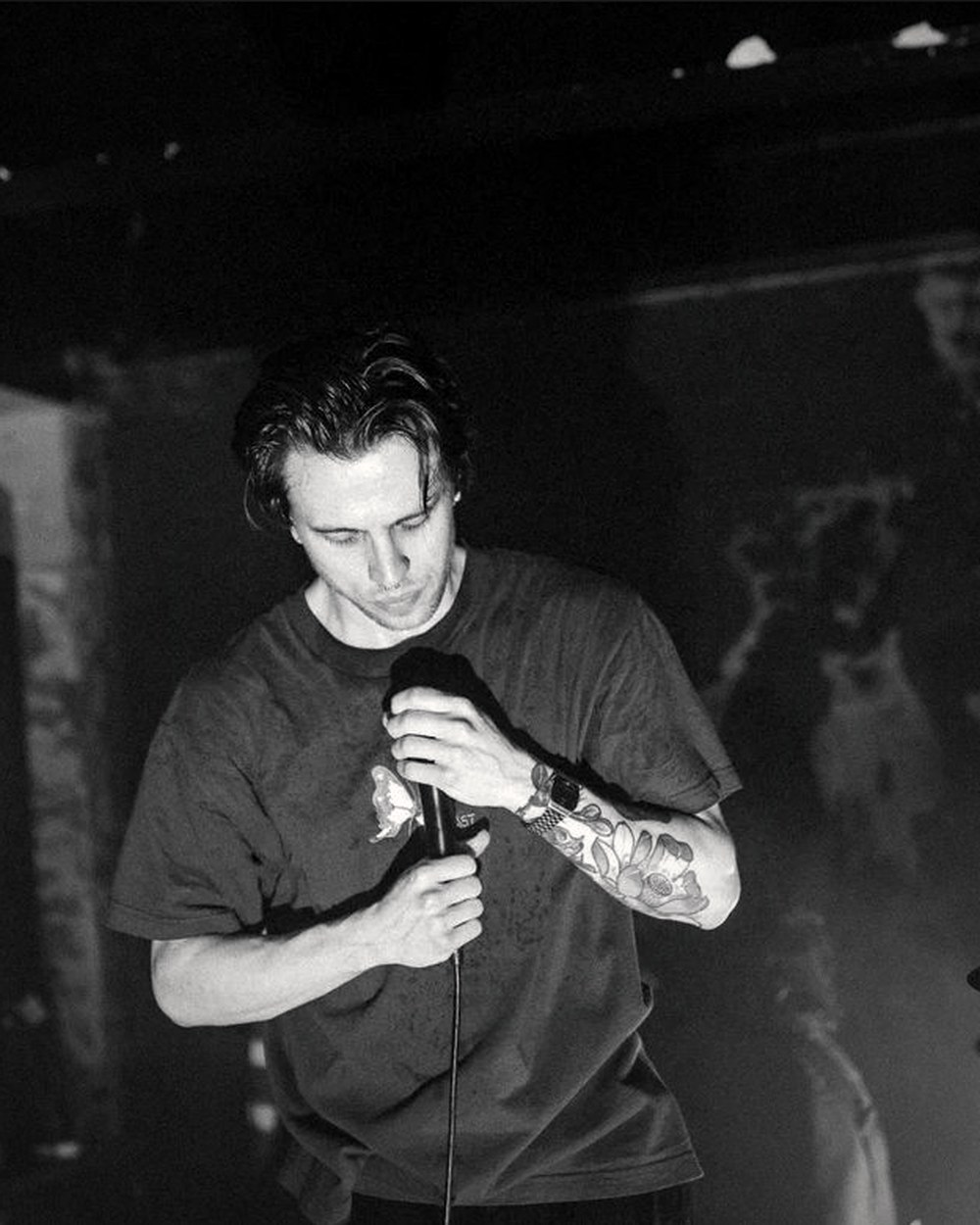 Jacob Wilkes head down over the microphone