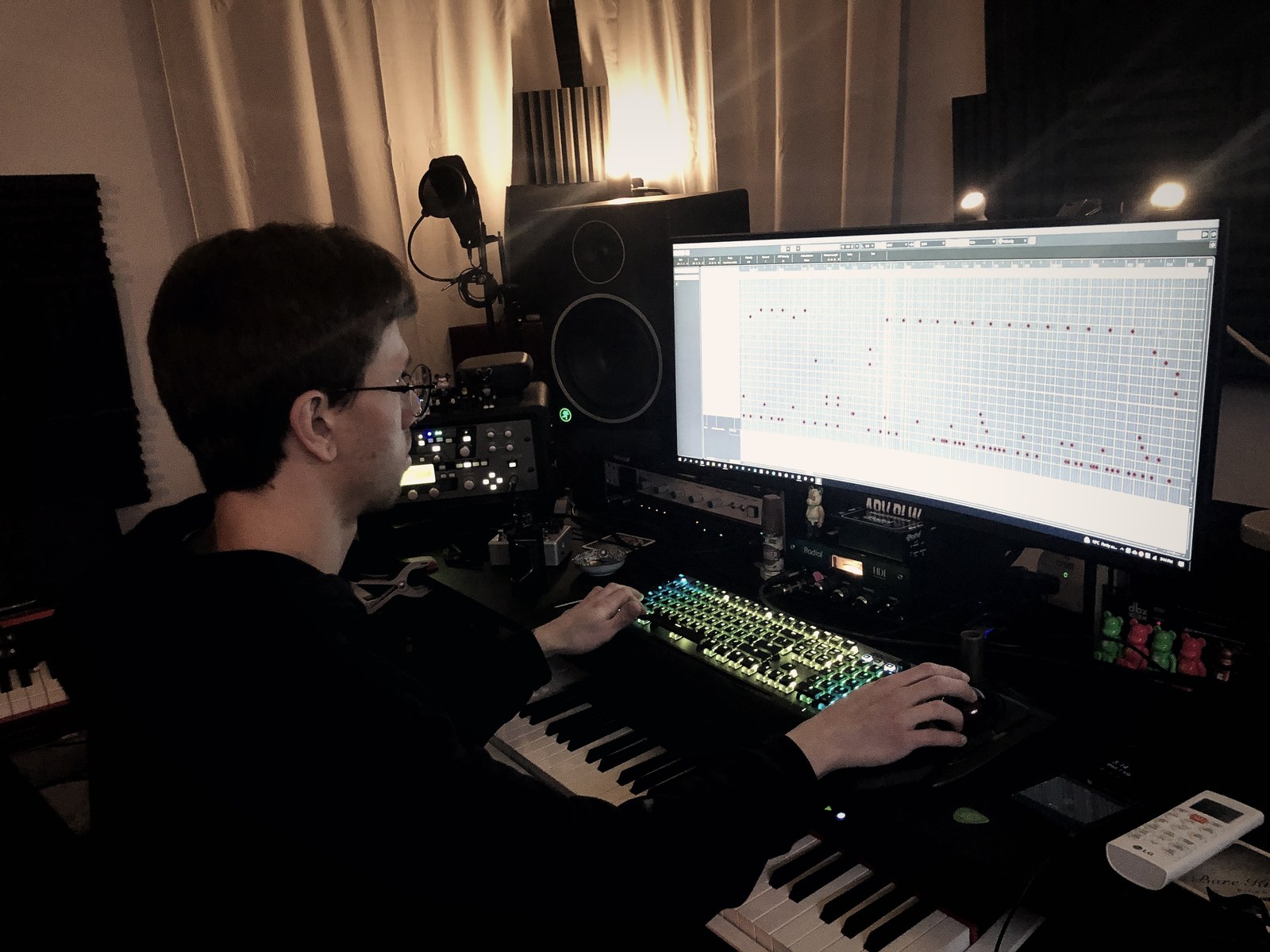 Working at the desk with an ultrawide monitor and synths